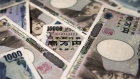 Japanese 10,000 and 1,000 yen banknotes are arranged for a photograph in Tokyo, Japan, on Tuesday, Sept. 5, 2017. Japanese stocks fell as the yen strengthened while investors prepared themselves for the economic damage that Hurricane Irma may inflict on Florida and mulled U.S. President Donald Trump’s most recent comments on North Korea. 