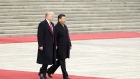 U.S. President Donald Trump, left, walks with Xi Jinping, China's president, during a welcome ceremony outside the Great Hall of the People in Beijing, China, on Thursday, Nov. 9, 2017.