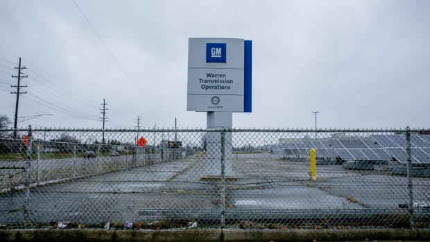 Signage stands on display outside the General Motors Co. transmission operation plant in Warren, Michigan. 