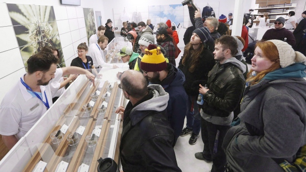 People check out the sample counter at a cannabis store in Winnipeg, Man., October 17, 2018
