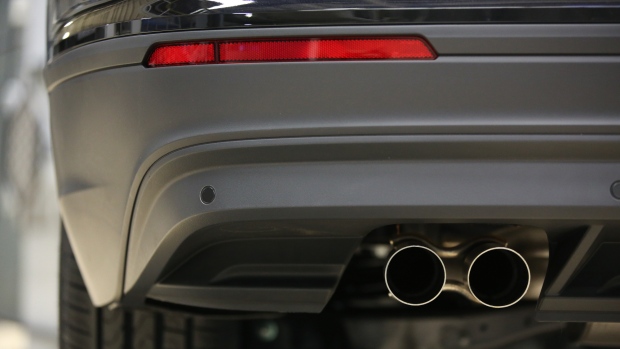 Exhaust pipes hang from the underside of a VW Tiguan automobile at the end of the production line at the Volkswagen Group Rus OOO plant in Kaluga, Russia, on Tuesday, Sept. 19, 2017. VW's return from debt market exile following its 2015 diesel emissions scandal has helped propel European bond sales past 1 trillion euros ($1.2 trillion) one month earlier than in 2016. 