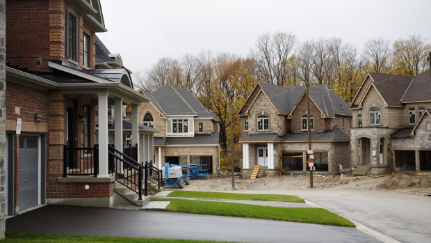 Homes for sale stand in East Gwillimbury, Ontario, Canada, on Friday, Nov. 2, 2018. STCA Canada is scheduled to release new housing price figures on Dec. 13. Photographer: Cole Burston/Bloomberg
