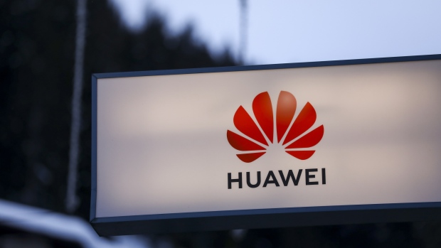 The logo of Huawei Technologies Co. Ltd. is seen on a sign at a pop-up office ahead of the World Economic Forum (WEF) in Davos, Switzerland, on Monday, Jan. 21, 2019. World leaders, influential executives, bankers and policy makers attend the 49th annual meeting of the World Economic Forum in Davos from Jan. 22 - 25. 