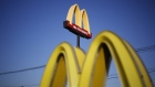 Signage is displayed outside a McDonald's Corp. fast food restaurant in Louisville, Kentucky, U.S. 