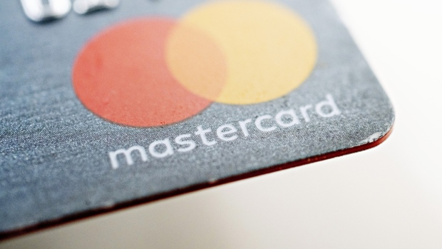 A Mastercard Inc. credit card is arranged for a photograph in Tiskilwa, Illinois, U.S., on Tuesday, Sept. 18, 2018. 