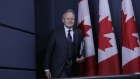 Stephen Poloz, governor of the Bank of Canada, arrive for a news conference at the National Press Theater in Ottawa, Ontario, Canada, on Wednesday, Oct. 25, 2017.