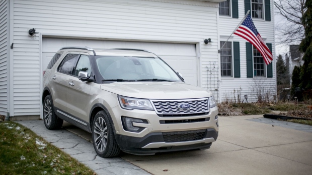 A Ford Motor Co. 2017 Explorer sports utility vehicle (SUV) sits outside a home in South Lyon