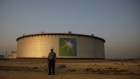 An employee visits the site of crude oil storage tanks at the Juaymah tank farm at Saudi Aramco's Ras Tanura oil refinery and oil terminal in Ras Tanura, Saudi Arabia, on Monday, Oct. 1, 2018 
