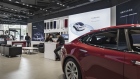 Tesla Motors Inc. electric vehicles sit on display at the company's showroom in Shanghai, China, on Tuesday, Sept. 12, 2017. China will consider granting foreign investors more access into its electric-vehicle market as the world’s biggest market for battery-powered automobiles comes out with new policy initiatives to give a fillip to the industry. 