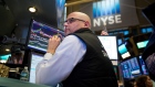 A trader works on the floor of the New York Stock Exchange (NYSE) in New York, U.S., on Friday, Oct.