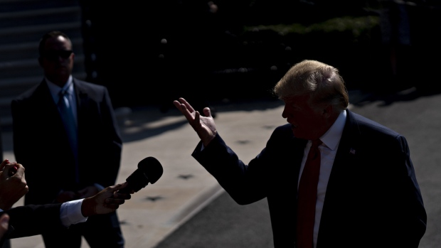 U.S. President Donald Trump speaks to members of the media before boarding Marine One on the South Lawn of the White House in Washington, D.C. 