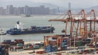 A container ship passes in front of containers and gantry cranes at the Haitian Container Terminal, operated by the Xiamen Port Authority, in Xiamen, China, on Monday, Aug. 26, 2019. After a weekend of confusing signals, only a few negotiators in Beijing see a deal possible ahead of the 2020 U.S. election, in part because it’s dangerous to advise President Xi Jinping to sign a deal that Trump may eventually break, according to Chinese officials familiar with the talks who asked not to be identified. 