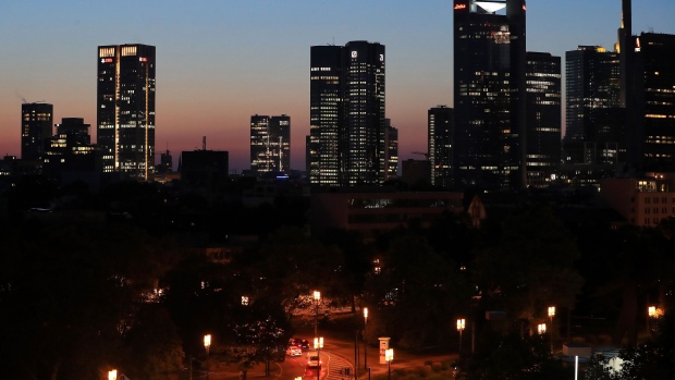 The Deutsche Bank AG headquarter twin-tower offices, center, is flanked by other skyscrapers on the city skyline at dawn in Frankfurt, Germany, on Tuesday, Sept. 10, 2019. Deutsche Bank Chief Financial Officer James von Moltke softened the lender’s mid-term revenue target just two months after setting it. 