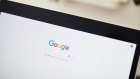 The Google Inc. homepage is displayed on an Apple Inc. laptop computer in this arranged photograph taken in the Brooklyn borough of New York, U.S., on Friday, July 19, 2019. Alphabet Inc. is scheduled to release earnings figures on July 25. 