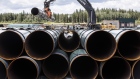 Pipe for the Trans Mountain pipeline is unloaded in Edson, Alta., June 18, 2019.  