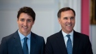 Prime Minister Justin Trudeau stands with Bill Morneau 