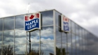 Maple Leaf Foods Inc. signage is displayed outside of the company's processing facility in the photo taken with a tilt-shift lens in Toronto, Ontario, Canada, on Monday, Oct. 17, 2011. 