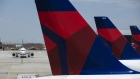 A Delta Air Lines Inc. plane taxis towards a gate at Salt Lake City International airport (SLC) in Salt Lake City, Utah, U.S., on Thursday, July 5, 2018. 