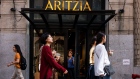 Pedestrians pass in front of an Aritzia Inc. store in New York, U.S., 