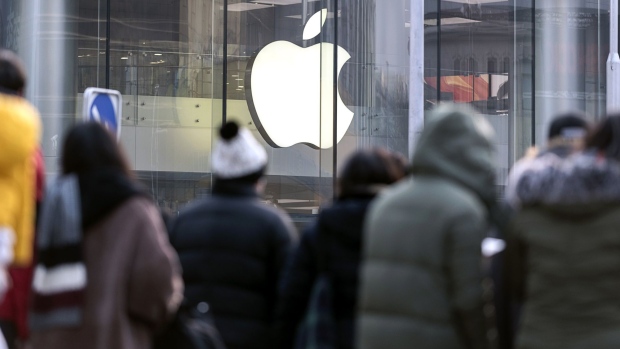 Pedestrians walk past the Apple Inc. store at Wangfujing in Beijing, China, on Thursday, Jan. 3, 2019.