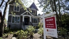 A "For Sale" sign is displayed outside a home in Vancouver, British Columbia, Canada, on Thursday, April 16, 2020. As its oil sector shriveled in recent years, Canada's economy became ever more driven by real estate, an industry now in a state of paralysis while its households are among the world's most indebted, poorly placed to weather the storm. Photographer: Jennifer Gauthier/Bloomberg