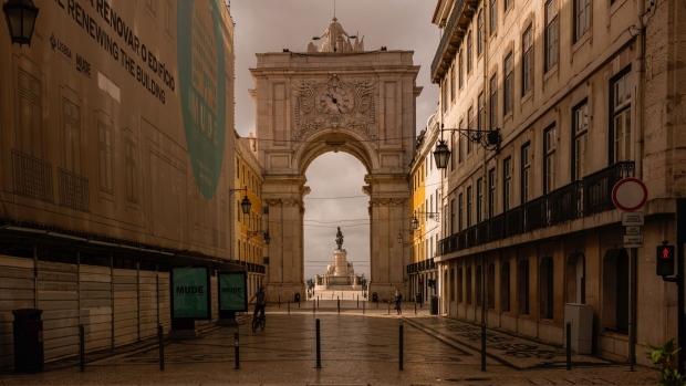 The Praca do Comercio viewed from a deserted Rua Augusta in Lisbon, Portugal, in May. Photographer: Jose Sarmento Matos/Bloomberg