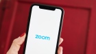 The logo for the Zoom Video Communications Inc. application is displayed on an Apple Inc. iPhone in an arranged photograph taken in the Brooklyn borough of New York, U.S., on Friday, April 10, 2020. Zoom's shares have soared in 2020 as the popularity of its video conferencing service has grown during a time of widespread lockdowns aimed at stemming the spread of the coronavirus pandemic. Photographer: Gabby Jones/Bloomberg
