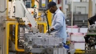 In this May 10, 2011 photo an autoworker assembles a transmission at the General Motors Transmission