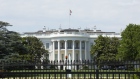 The White House stands behind perimeter fencing in Washington. Photographer: Stefani Reynolds/Bloomberg