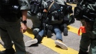 Police make an arrest during a protest in Hong Kong on July 1. Photographer: Roy Liu/Bloomberg