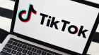 Signage for ByteDance Ltd.'s TikTok app is displayed on a laptop computer in an arranged photograph taken in the Brooklyn borough of New York, U.S., on Wednesday, July 1, 2020. India's unprecedented decision to ban 59 of China’s largest apps is a warning to China's tech giants, who for years thrived behind a government-imposed Great Firewall that kept out many of America’s best-known internet names. Photographer: Gabby Jones/Bloomberg