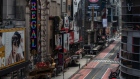 A nearly empty street is seen in Times Square in New York on June 11. Photographer: Jeenah Moon/Bloomberg