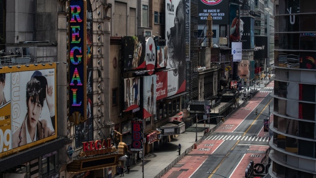 A nearly empty street is seen in Times Square in New York on June 11. Photographer: Jeenah Moon/Bloomberg