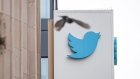 A bird flies near signage displayed outside of Twitter headquarters in San Francisco, California, U.S., on Thursday, July 16, 2020. 