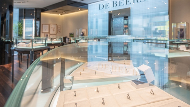 Diamond jewelry is displayed in cabinets inside a De Beers SA store in Hong Kong, China, on Thursday