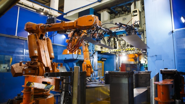 ABB Ltd. robotic arms position steel sheets for stamping auto parts in Spain. Photographer: Angel Navarrete/Bloomberg