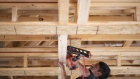 A worker uses a nail gun in a home under construction at a Romanelli and Hughes Building Co. subdivision in Dublin, Ohio, U.S., on Thursday, July 9, 2020. The U.S. housing market this week surprised economists by rallying in the midst of a pandemic. But the coronavirus may drag down home values after all. Photographer: Ty Wright/Bloomberg