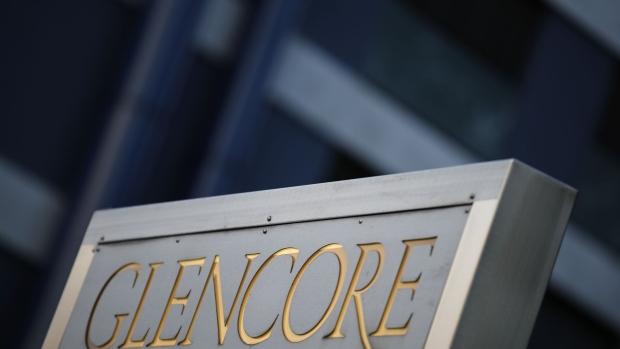 Signage stands near the Glencore Plc headquarters office in Baar, Switzerland, on Friday, July 6, 2018. Glencore will buy back as much as $1 billion of its shares, a move that may soothe investor concerns after the worlds top commodity trader was hit by a U.S. Department of Justice probe earlier this week.