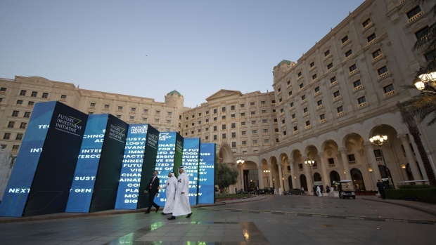 Attendees leave the venue on day two of the Future Investment Initiative (FII) forum at the Ritz Carlton hotel in Riyadh, Saudi Arabia, on Wednesday, Oct. 30, 2019. Crown Prince Mohammed bin Salman will determine the timing of oil giant Saudi Aramco’s long-anticipated share sale, according to the kingdom’s energy minister.