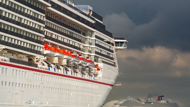 The Carnival Corp. Miracle and Panorama cruise ships sit acnhored at the Port of Long Beach in Long Beach, California, U.S., on Monday, April 13, 2020. The Centers for Disease Control and Prevention extended its “No Sail Order” for all cruise ships by at least 100 days -- or until Covid-19 is no longer considered a public health emergency. Photographer: Tim Rue/Bloomberg