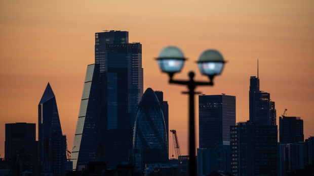 Skyscrapers stand in the City of London square mile financial district as the sun sets in London, U.K., on Monday, Sept. 14, 2020. Londoners are steadily increasing their use of public transport after schools reopened, freeing parents to go back to the workplace. Photographer: Simon Dawson/Bloomberg