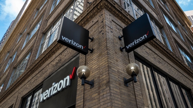 Signage is displayed outside a Verizon Communications Inc. store in San Francisco.