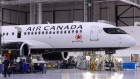 An Airbus SE A220 plane with Air Canada Livery sits at the end of the assembly line at the Airbus Canada LP assembly and finishing site in Mirabel, Quebec, Canada, on Thursday, Feb. 20, 2020. Airbus CEO Guillaume Faury said that the company plans to invest up to 1 billion euros on the A220 this year.