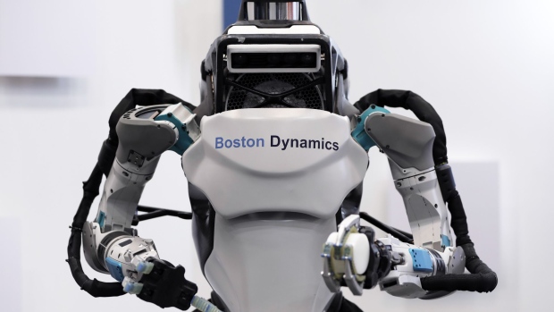 A Boston Dynamics Inc. Atlas humanoid robot is displayed at the SoftBank Robot World 2017 in Tokyo, Japan, on Tuesday, Nov. 21, 2017. SoftBank Chief Executive Officer Masayoshi Son has put money into robots, artificial intelligence, microchips and satellites, sketching a vision of the future where a trillion devices are connected to the internet and technology is integrated into humans. Photographer: Kiyoshi Ota/Bloomberg