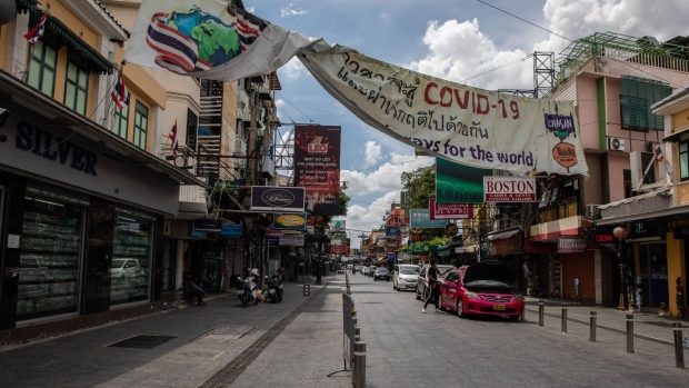 A Covid-19 sign hangs at an entrance to a near-empty Khao San Road in Bangkok, Thailand, on Wednesday, Sept. 2, 2020. Thailand has reported zero locally-transmitted Covid-19 cases for 100 days in a row, joining a small group of places like Taiwan where the pathogen has been virtually eliminated. Photograph: Taylor Weidman/Bloomberg Photographer: Taylor Weidman/Bloomberg