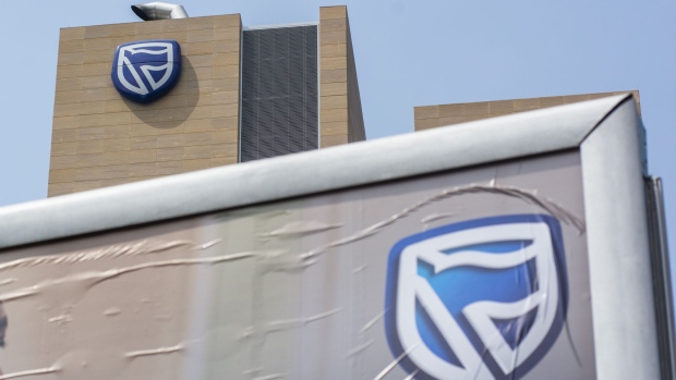 A logo sits on display outside the offices of Standard Bank Group Ltd. bank in Johannesburg, South Africa, on Wednesday, Sept. 23, 2020. South Africa’s biggest lenders were faced with the pressing need to raise provisions to protect against souring loans, while demand for credit slumped as the coronavirus lockdown took a toll on business customers.