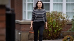 Meng Wanzhou, chief financial officer of Huawei Technologies Co., leaves her home to attend Supreme Court for a hearing in Vancouver, British Columbia, Canada, on Wednesday, Nov. 25, 2020. Meng was charged in 2019 with fraud and is currently fighting extradition to the U.S. from Canada.