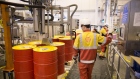 An employee watches as a machine fills barrels with lubricant oil at the Royal Dutch Shell Plc lubricants blending plant in Torzhok, Russia, on Wednesday, Feb. 7, 2018. The oil-price rally worked both ways for Royal Dutch Shell Plc as improved exploration and production lifted profit to a three-year high while refining and trading fell short of expectations as margins shrank. Photographer: Andrey Rudakov/Bloomberg