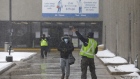 Workers enter the Canada Post Corp. Gateway East sorting facility in Toronto, Ontario, Canada, Tuesday, Jan. 26, 2021. Canada Post says it has begun testing an entire shift of employees for Covid-19 at a Mississauga facility after 121 workers there tested positive for the virus in the last three weeks, CBC News reports. Photographer: Cole Burston/Bloomberg