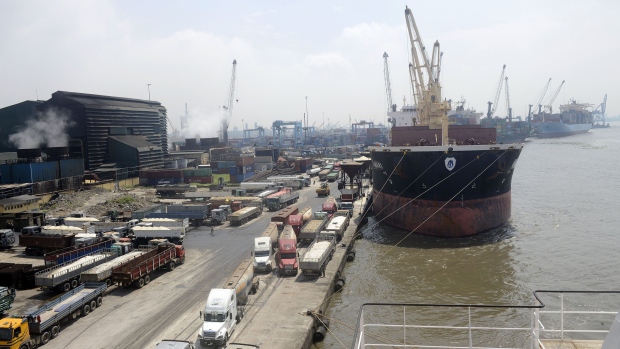 Cargo ships are docked at the Apapa Sea Port in Lagos. Nigerian gross domestic production will ease from the estimated rate of 6.9 percent for 2014, according to the IMF’s most recent outlook published in October.